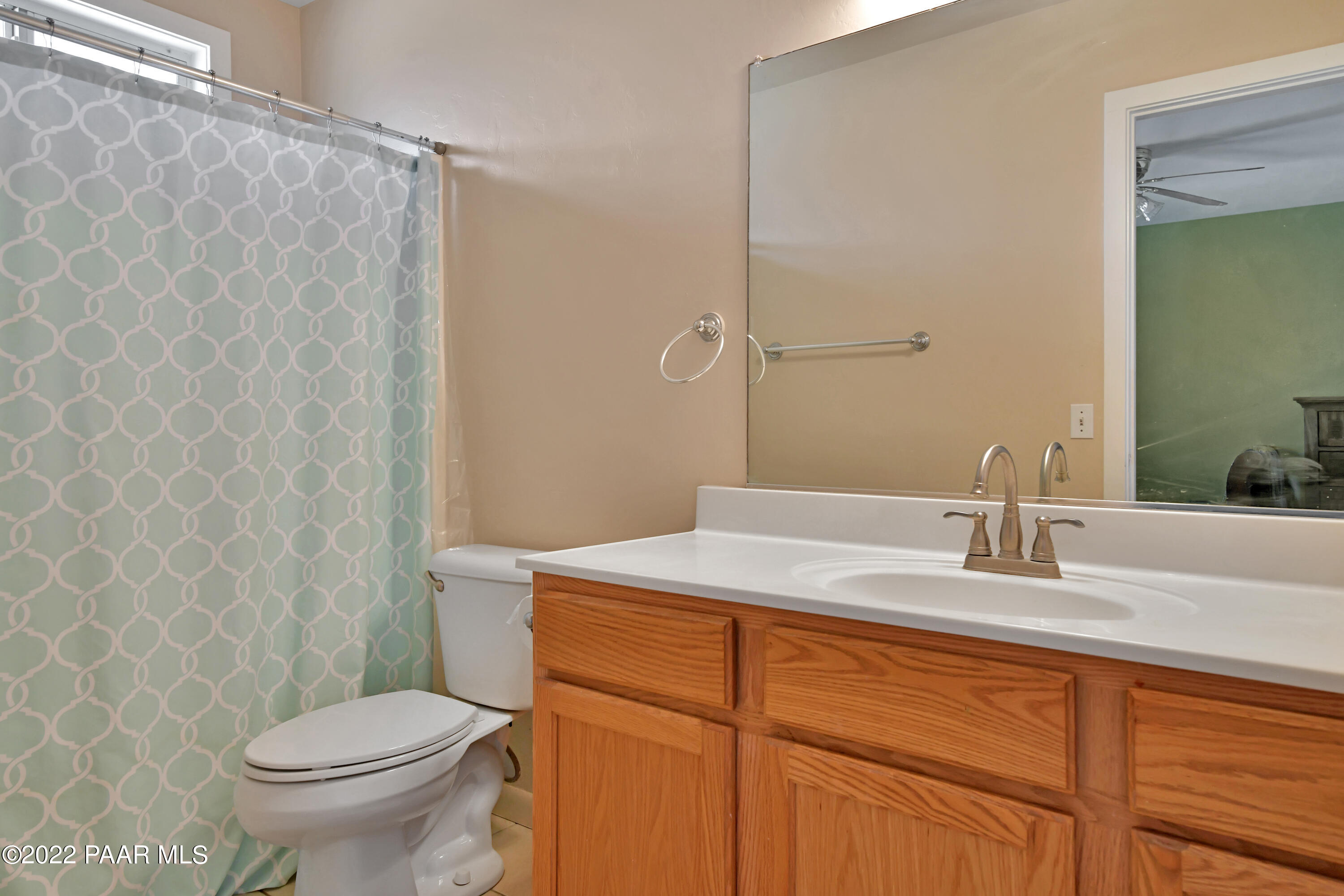 25820 Poppy Road Paulden, AZ 86334 - Photo 18 of 28 a bathroom with a granite countertop sink toilet and a mirror