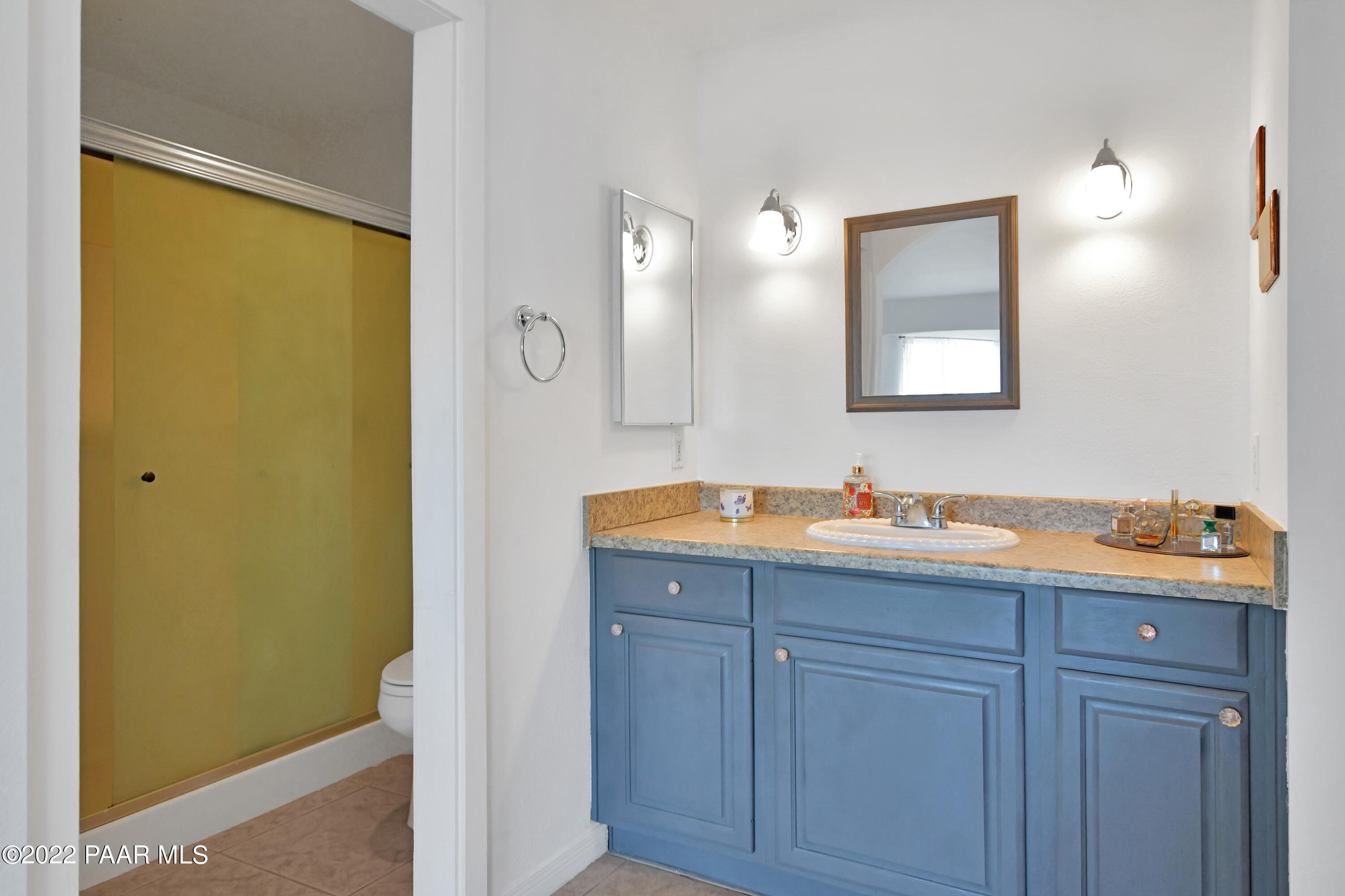 25820 Poppy Road Paulden, AZ 86334 - Photo 23 of 28 a bathroom with a granite countertop sink and a mirror