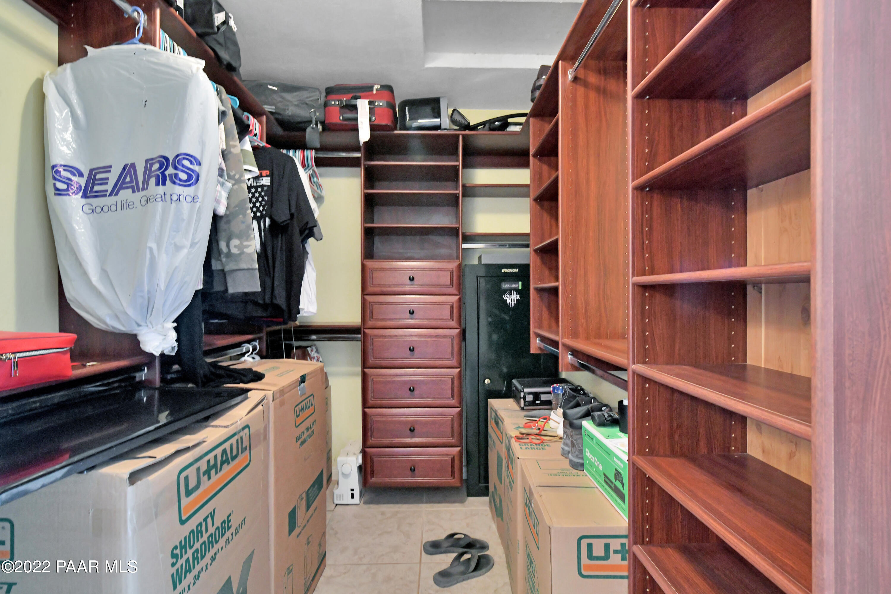25820 Poppy Road Paulden, AZ 86334 - Photo 24 of 28 a view of walk in closet with clothes and shoes