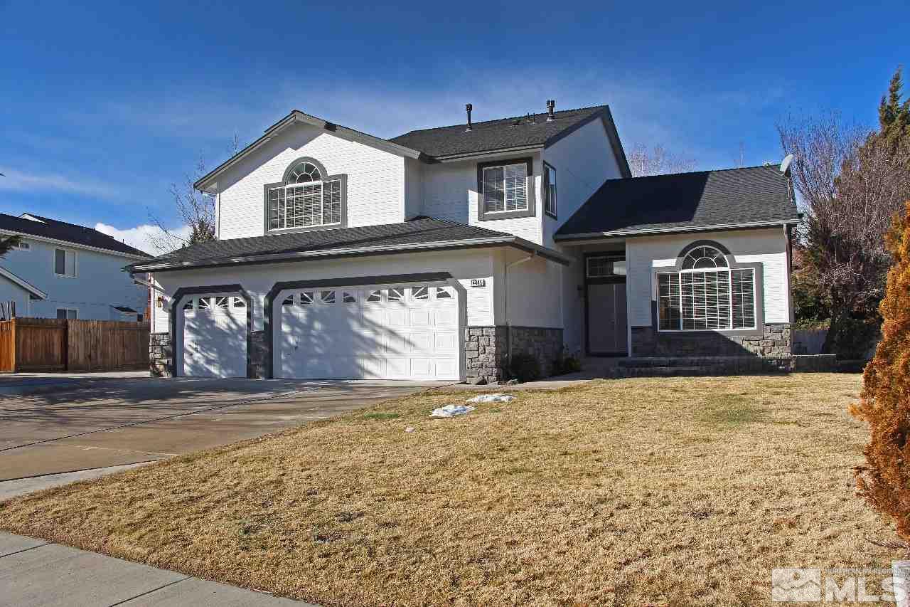 14445 Ghost Rider Drive Reno, NV 89511 - Photo 1 of 1 a front view of a house with a yard