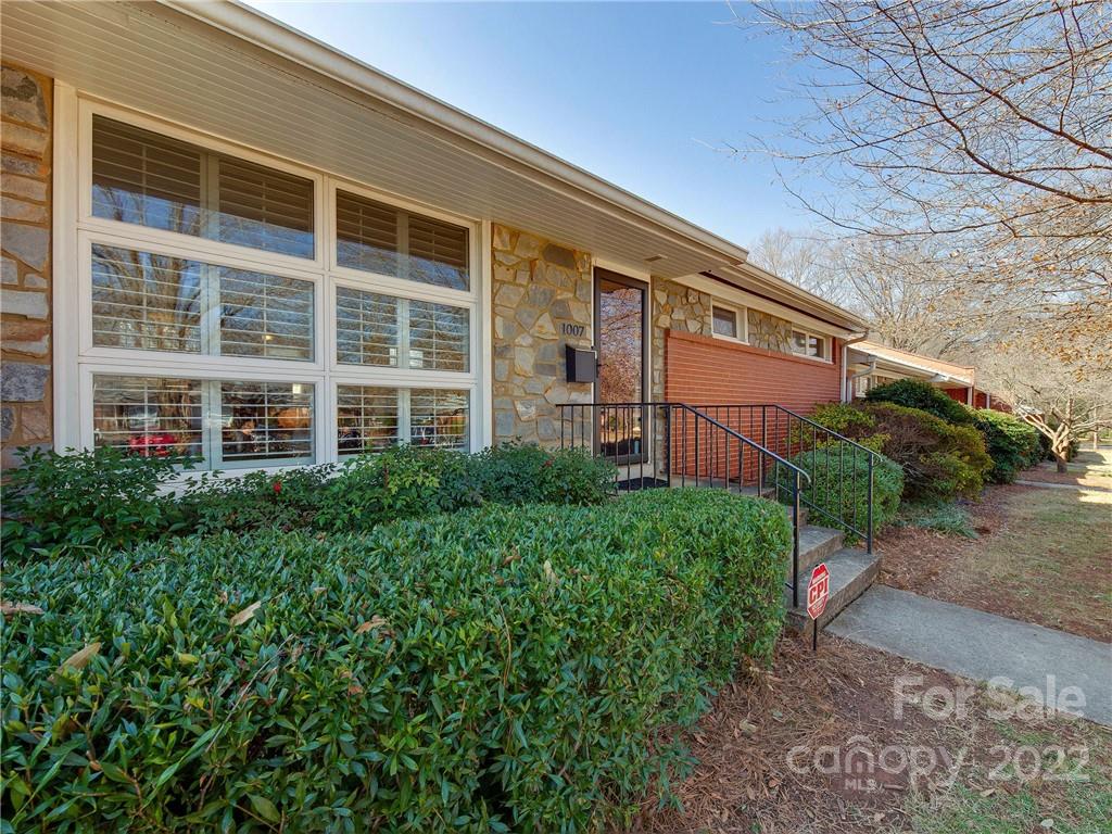 1007 Andover Road, Unit A3 Charlotte, NC 28211 - Photo 1 of 38 a view of a building with a garden
