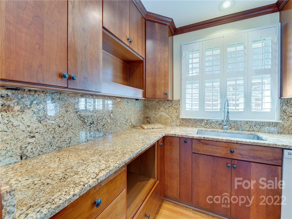 1007 Andover Road, Unit A3 Charlotte, NC 28211 - Photo 17 of 38 a kitchen with a sink and a window