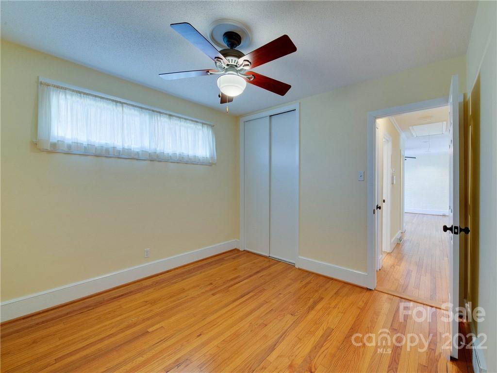 1007 Andover Road, Unit A3 Charlotte, NC 28211 - Photo 26 of 38 a view of an empty room with wooden floor