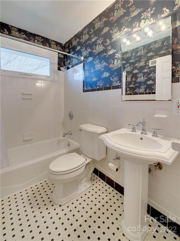 1007 Andover Road, Unit A3 Charlotte, NC 28211 - Photo 28 of 38 a bathroom with a sink a toilet and shower