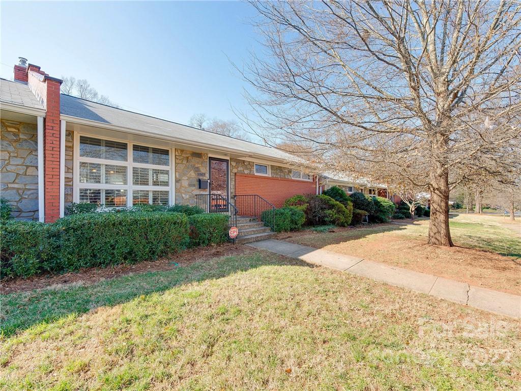 1007 Andover Road, Unit A3 Charlotte, NC 28211 - Photo 31 of 38 a view of a house with a yard and pathway