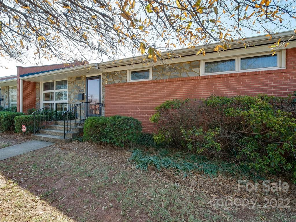 1007 Andover Road, Unit A3 Charlotte, NC 28211 - Photo 34 of 38 a view of a house with a yard