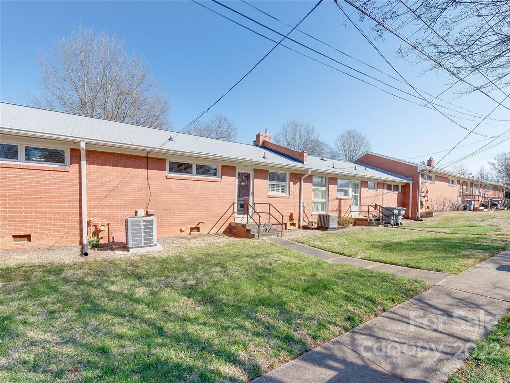 1007 Andover Road, Unit A3 Charlotte, NC 28211 - Photo 35 of 38 a view of a house with a big yard and large tree
