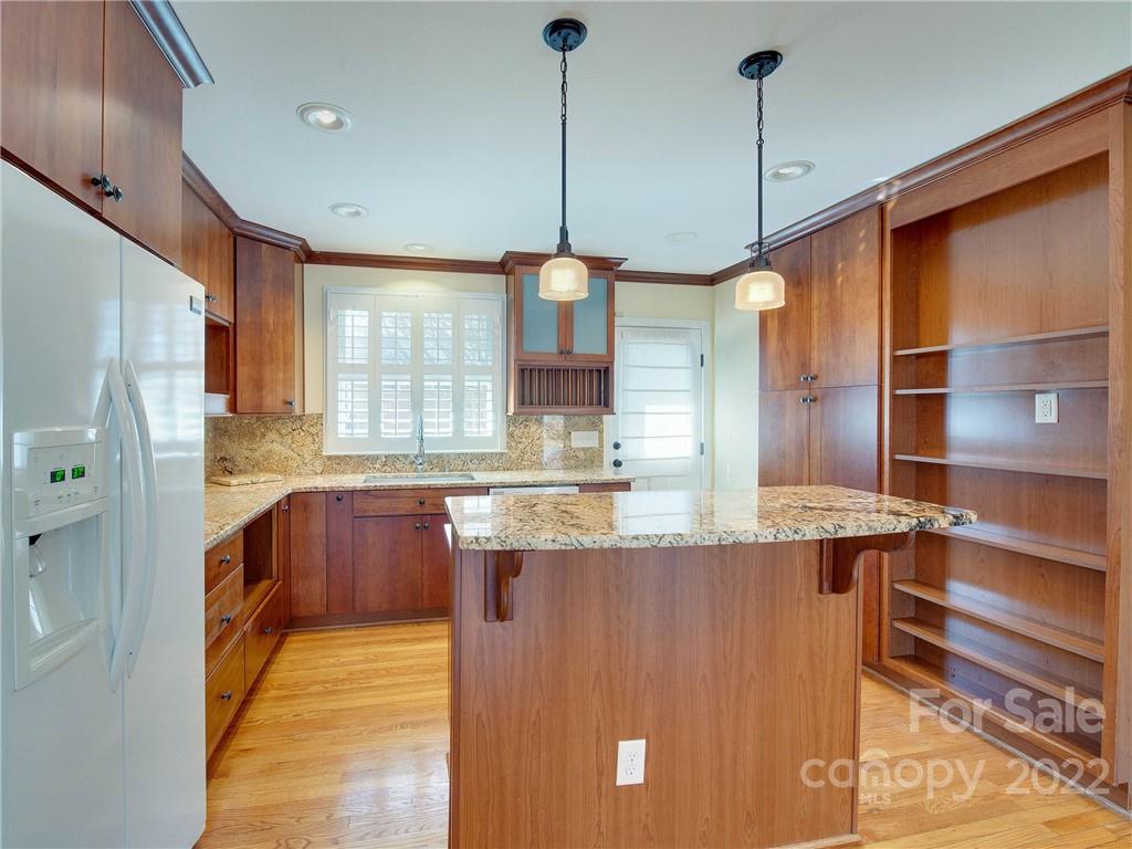 1007 Andover Road, Unit A3 Charlotte, NC 28211 - Photo 4 of 38 a kitchen with stainless steel appliances granite countertop a sink a oven and a refrigerator