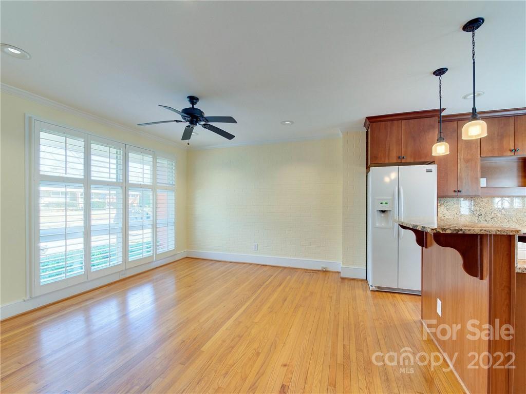 1007 Andover Road, Unit A3 Charlotte, NC 28211 - Photo 8 of 38 a view of an empty room with window and wooden floor