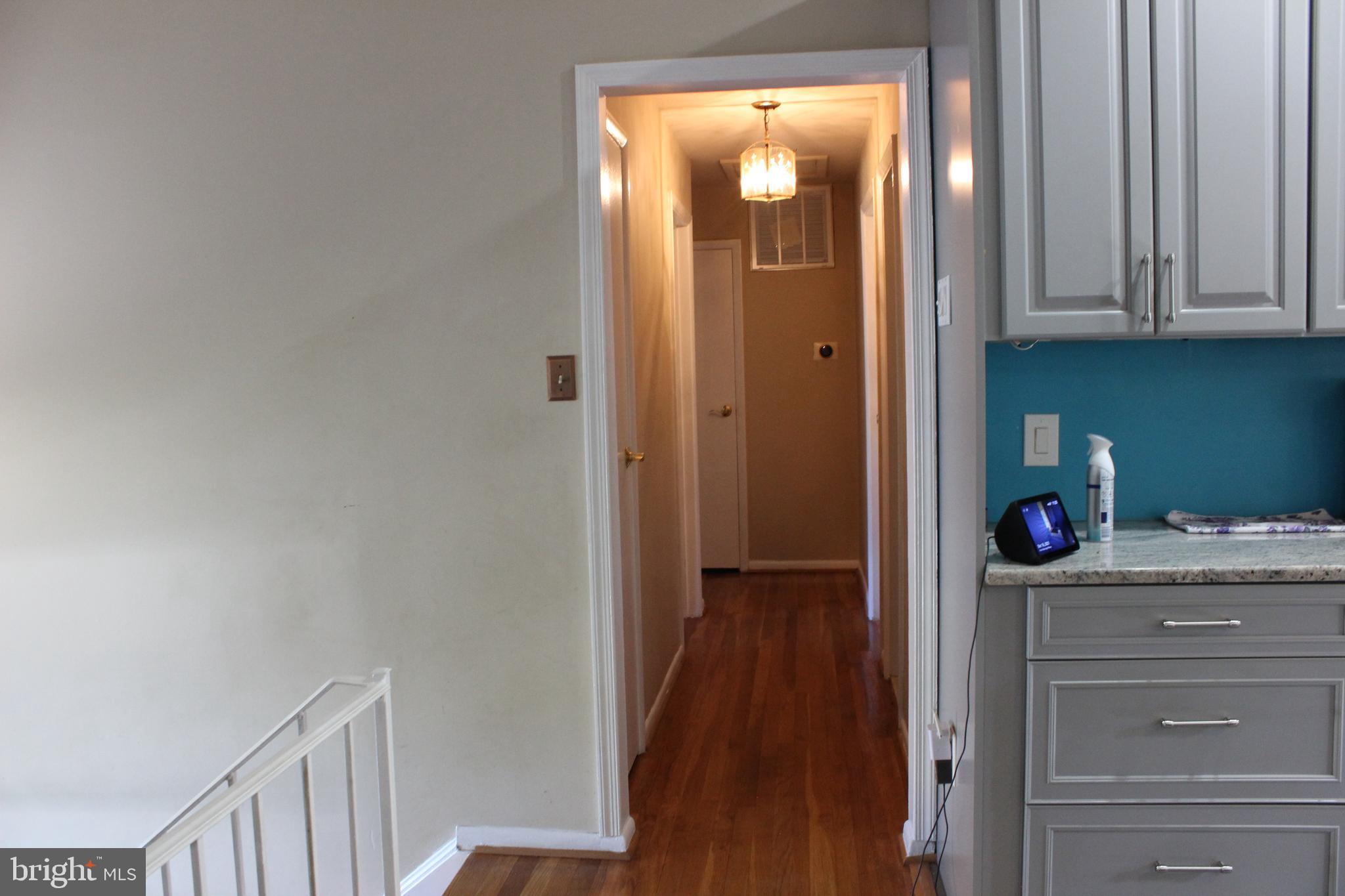 418 Florida Avenue Herndon, VA 20170 - Photo 10 of 14 a view of a hallway with closet and wooden floor