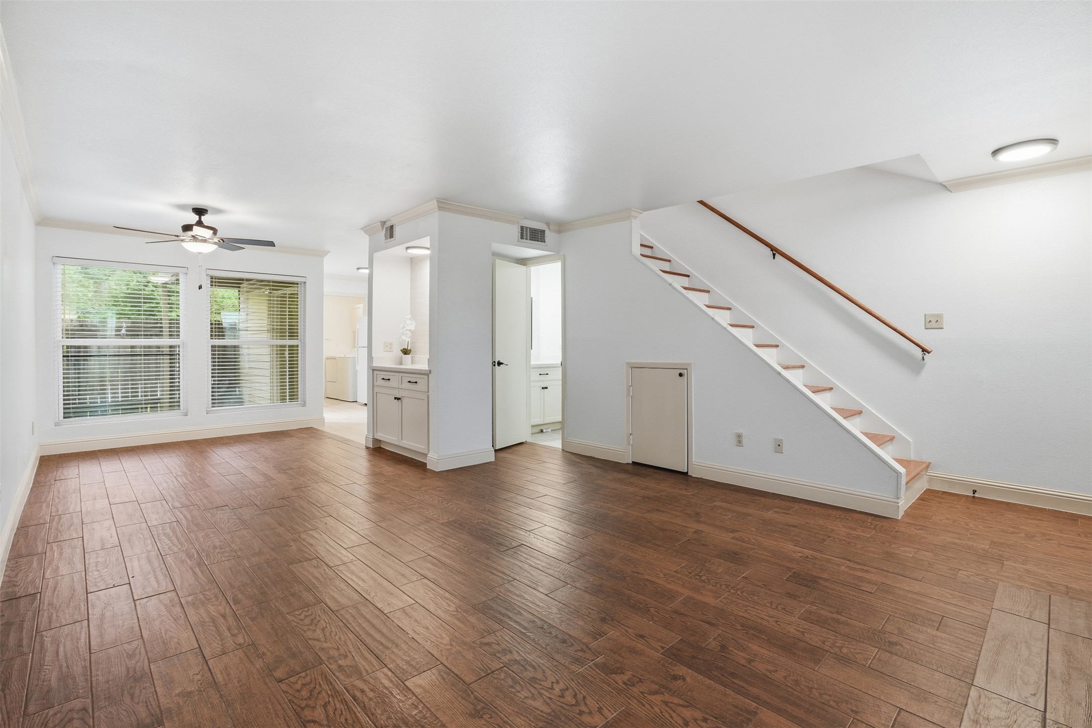 2200 Cypress Landing Road, Unit A3 Houston, TX 77090 - Photo 3 of 17 Spacious open-concept living and dining area with beautiful flooring.