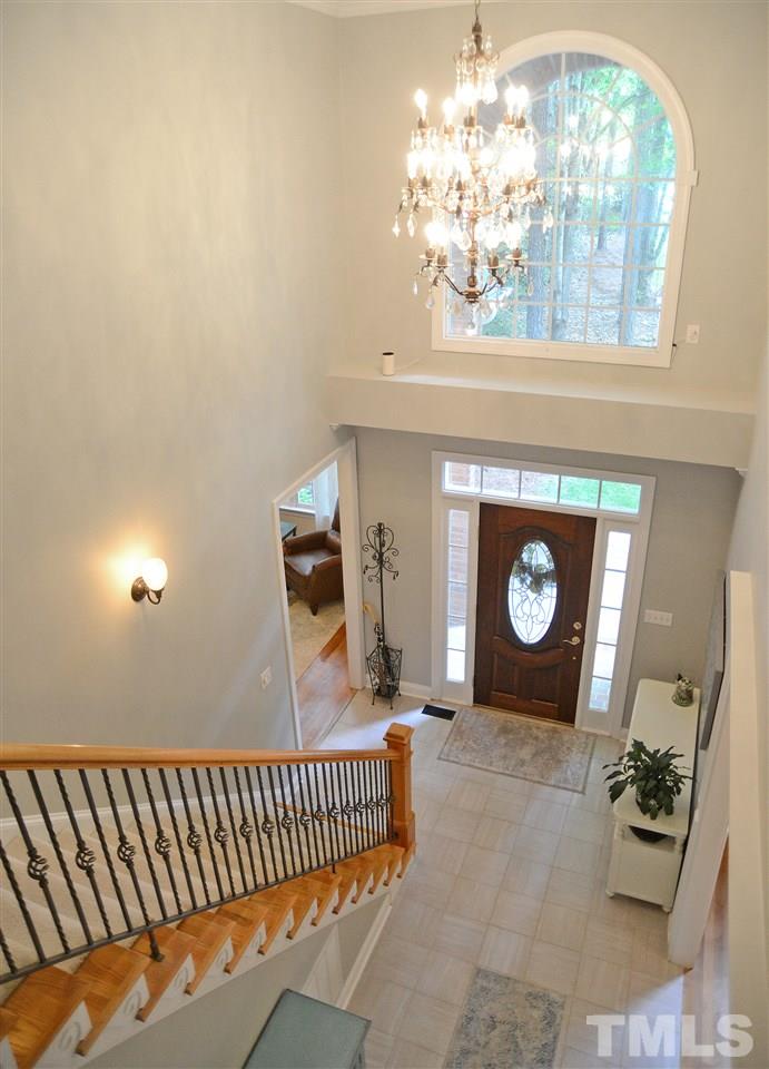 5800 Stone Canyon Court Raleigh, NC 27613 - Photo 2 of 30 Warm welcome for your visitors and guest in this two story foyer with mahogany front door! Updated tile floor!