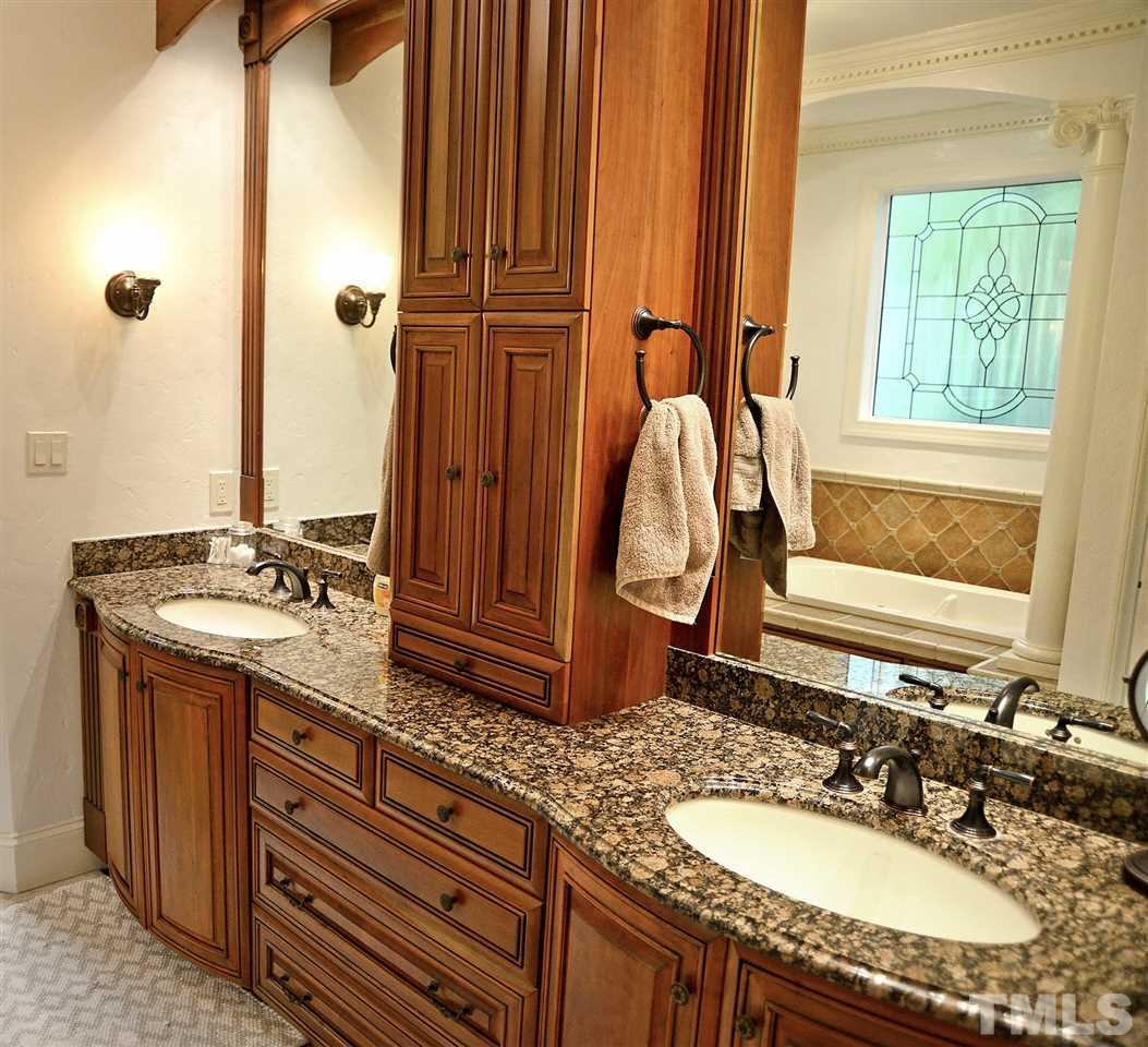 5800 Stone Canyon Court Raleigh, NC 27613 - Photo 11 of 30 Ooh la la! You will want to retreat to this incredible spa bathroom often! Dual vanities w/custom built cabinetry, granite tops, heated floors, Bain ultra air jet tub w/Chromatherapy system, HUGE doorless walk in shower with body jets & rain shower. WOW!
