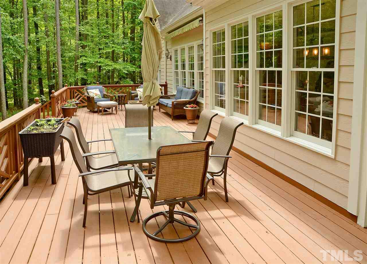 5800 Stone Canyon Court Raleigh, NC 27613 - Photo 19 of 30 Outdoor living space galore! Room for a sitting area under the awning PLUS a large outdoor table for enjoying those perfect evenings. You will find that great care has been taken care of every aspect of this fabulous home!