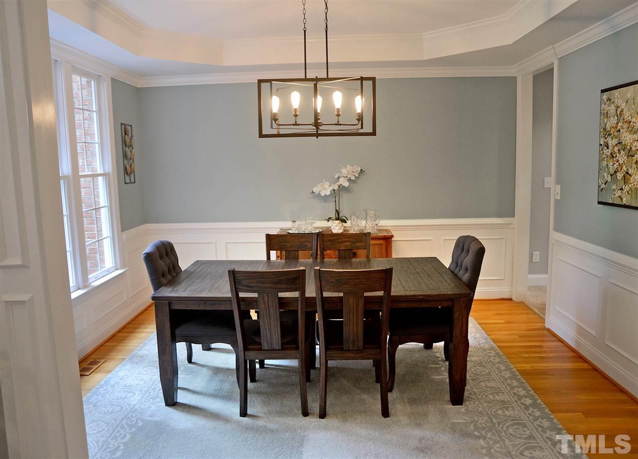 5800 Stone Canyon Court Raleigh, NC 27613 - Photo 3 of 30 Lovely dining room with wainscoting and trey ceiling, updated fixture, updated paint, hardwoods!