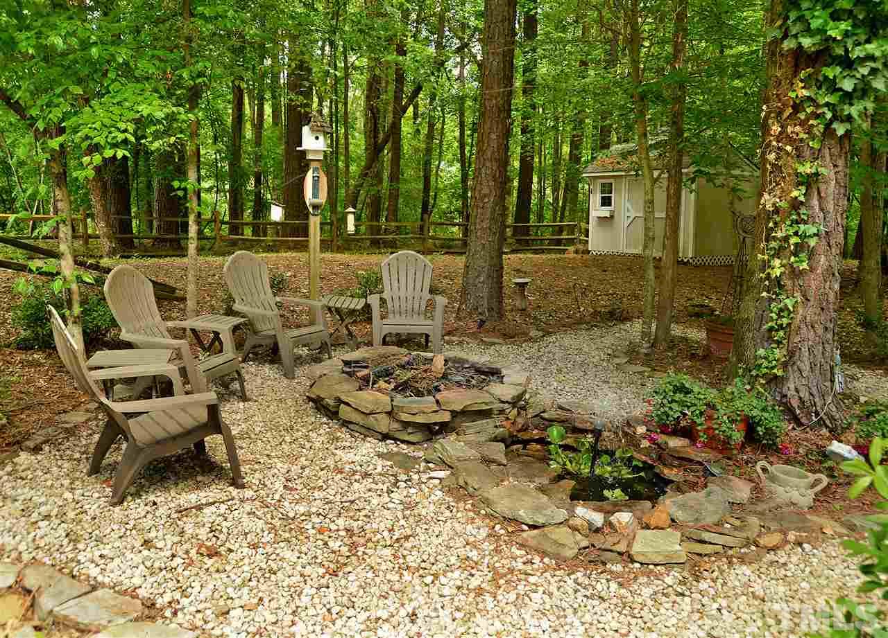 5800 Stone Canyon Court Raleigh, NC 27613 - Photo 22 of 30 Spend cool nights with friends and family making memories in this sweet spot! Added ambiance with the trickle of the water feature compliment the fire pit with plenty of room to gather! Great for summer relaxing too!