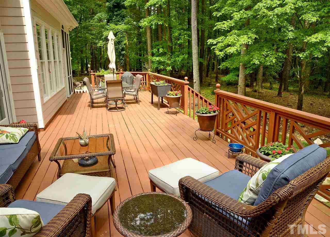 5800 Stone Canyon Court Raleigh, NC 27613 - Photo 8 of 30 Oh deer! Yes, you will surely see those and all sorts of nature from this HUGE deck that runs along the entire back of the home! What a beautiful place to unwind and find solace! Built in awning offers shade on those hot days!