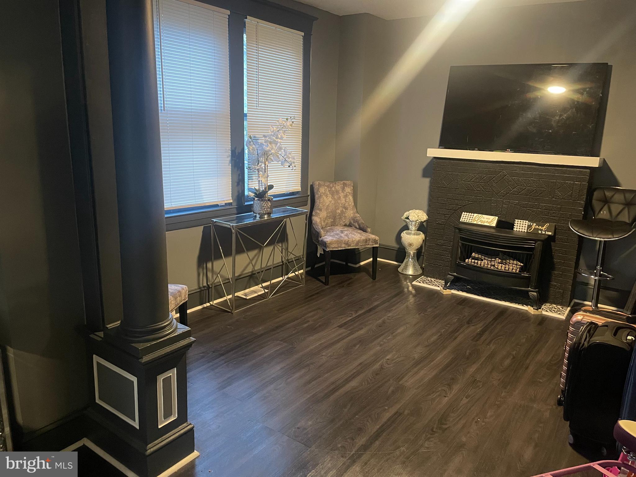 4220 Hamilton Avenue Baltimore, MD 21206 - Photo 11 of 28 a living room with furniture and a wooden floor