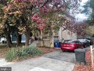 4220 Hamilton Avenue Baltimore, MD 21206 - Photo 2 of 28 a front view of a house with a garden