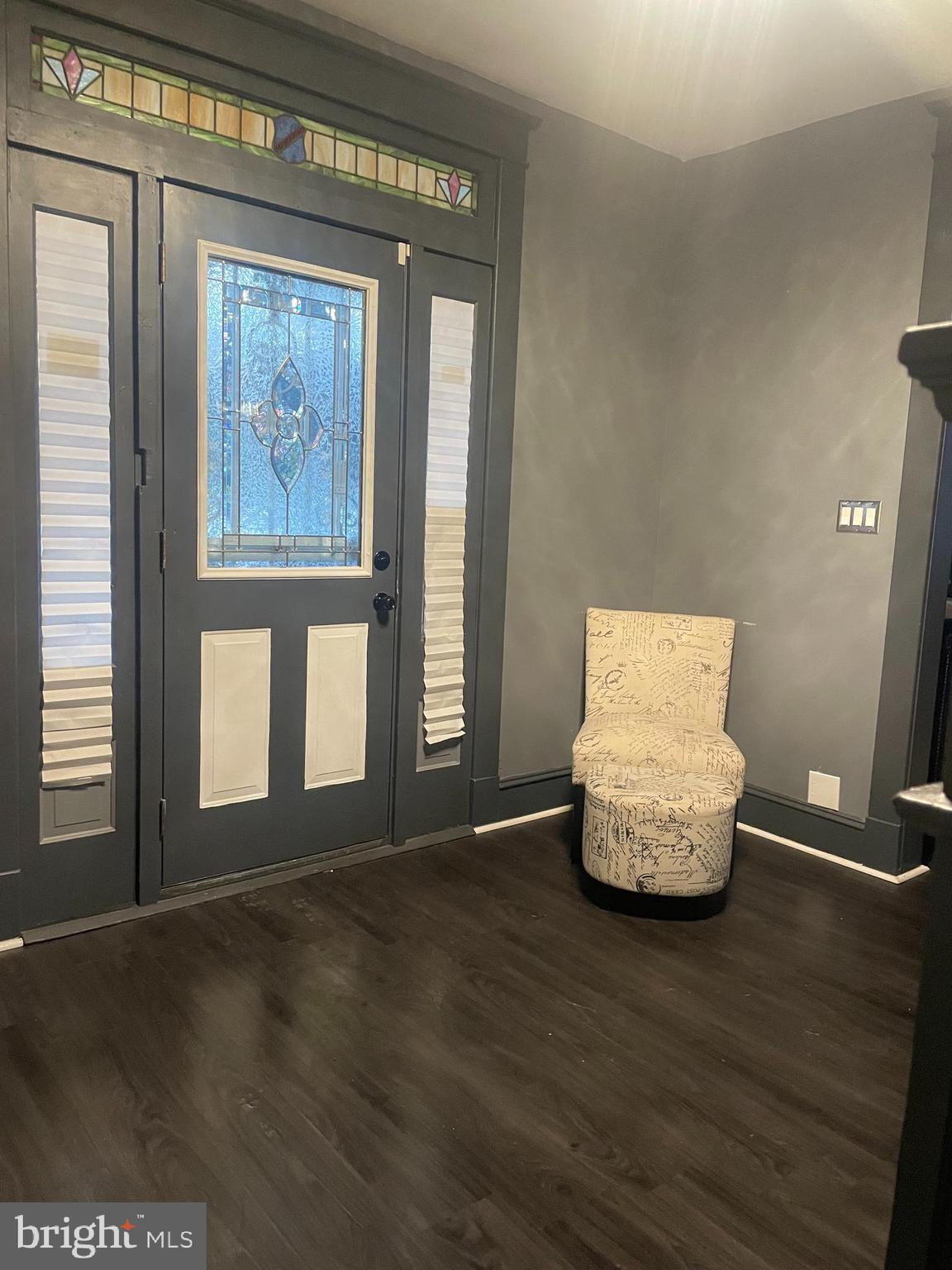 4220 Hamilton Avenue Baltimore, MD 21206 - Photo 7 of 28 a room with wooden floor and window