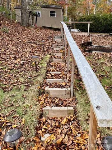 a living room with furniture a flat screen tv and a table