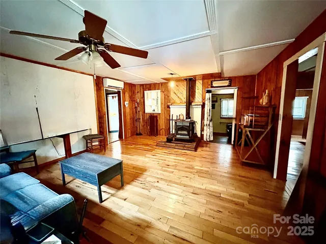a room with wooden floor and furniture