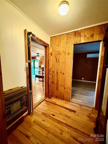 a living room with a fireplace furniture and a large window