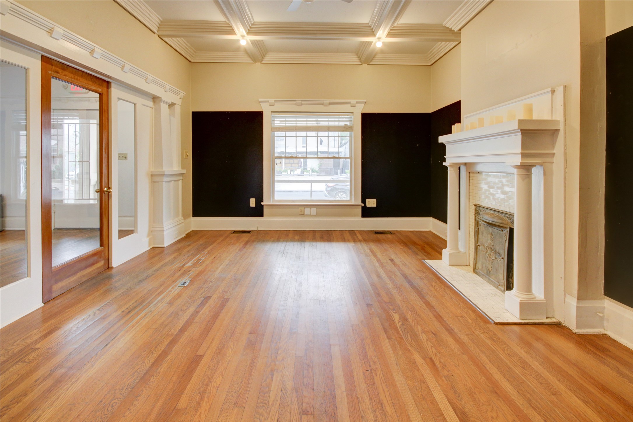 239 Westheimer Road Houston, TX 77006 - Photo 10 of 50 This space features a stunning coffered ceiling, rich hardwood floors, and elegant 8-inch baseboards—all combining to add warmth, depth, and timeless character.