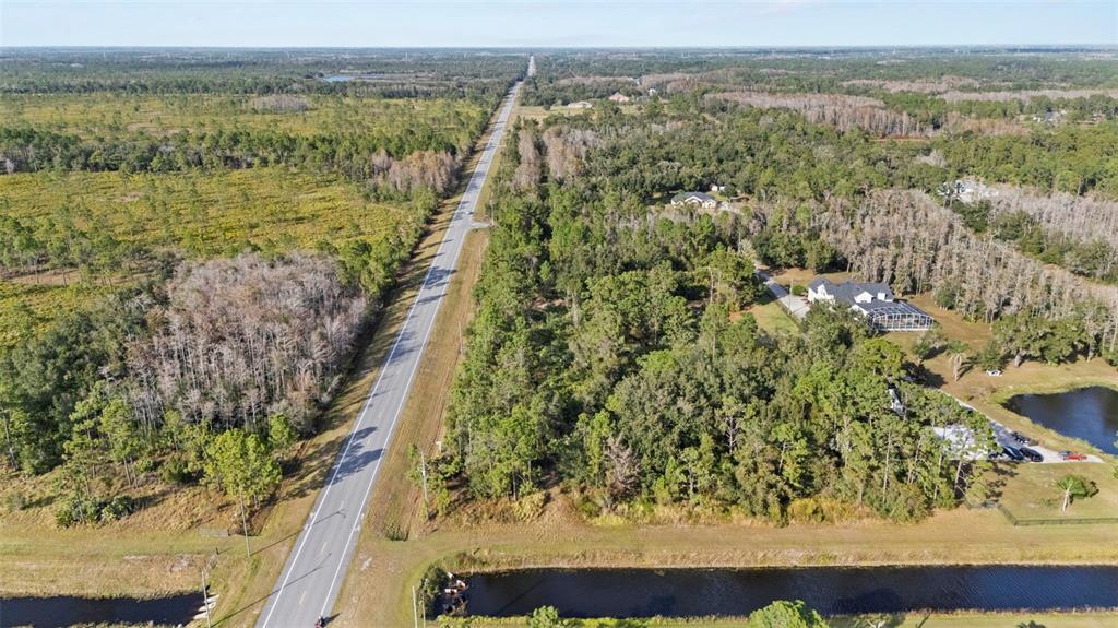 2 Ralston Street Orlando, FL 32833 - Photo 6 of 12 a view of a lake with an outdoor space