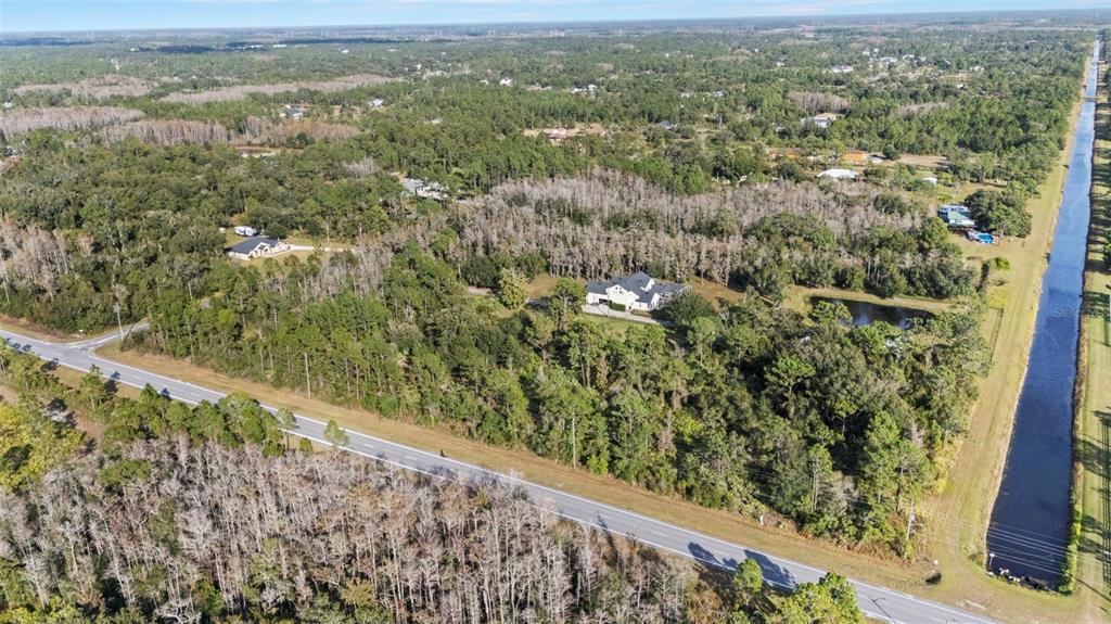 2 Ralston Street Orlando, FL 32833 - Photo 7 of 12 a view of a green field with lots of trees