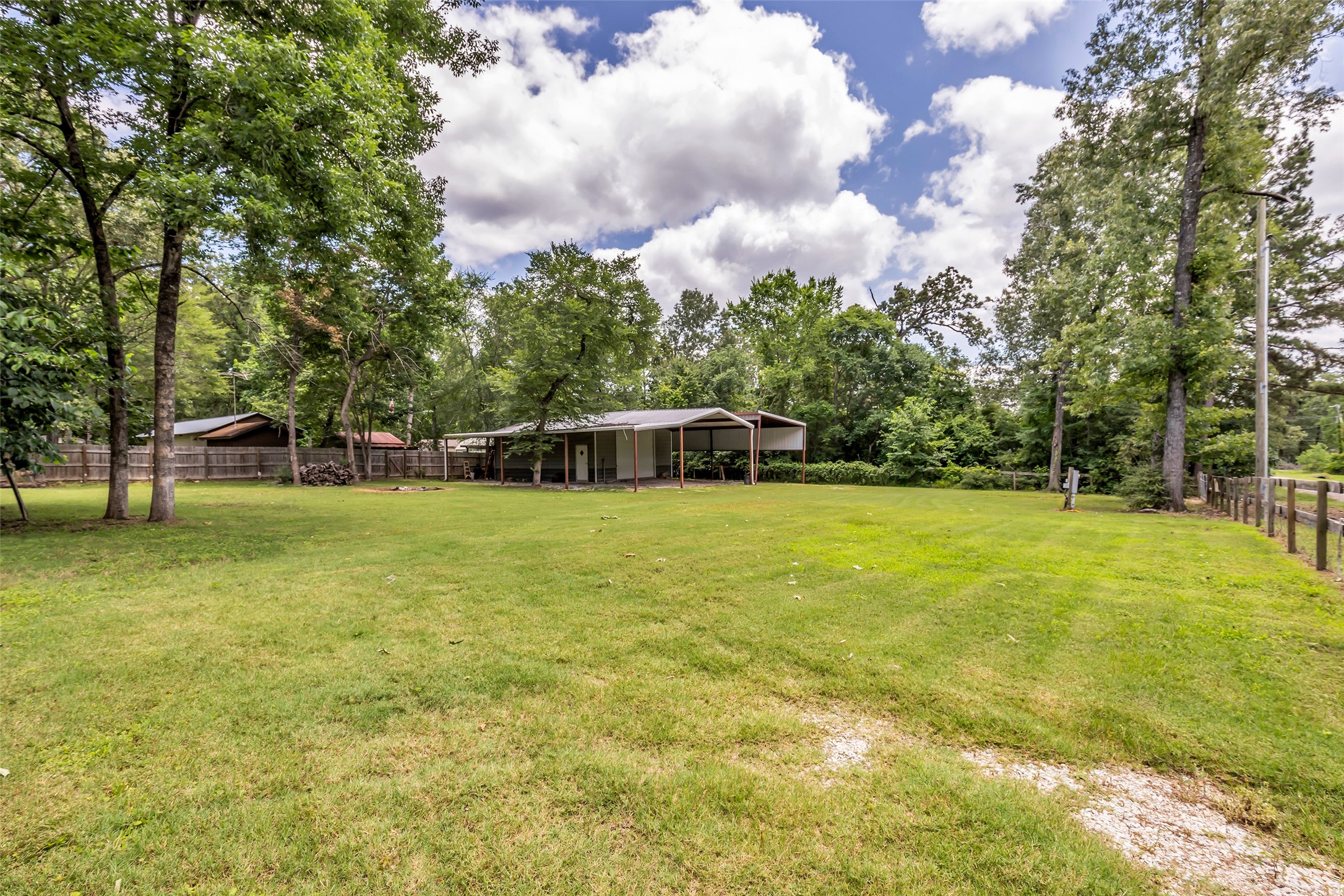 188 Chrissy Lane Trinity, TX 75862 - Photo 20 of 25 a front view of a house with garden and trees