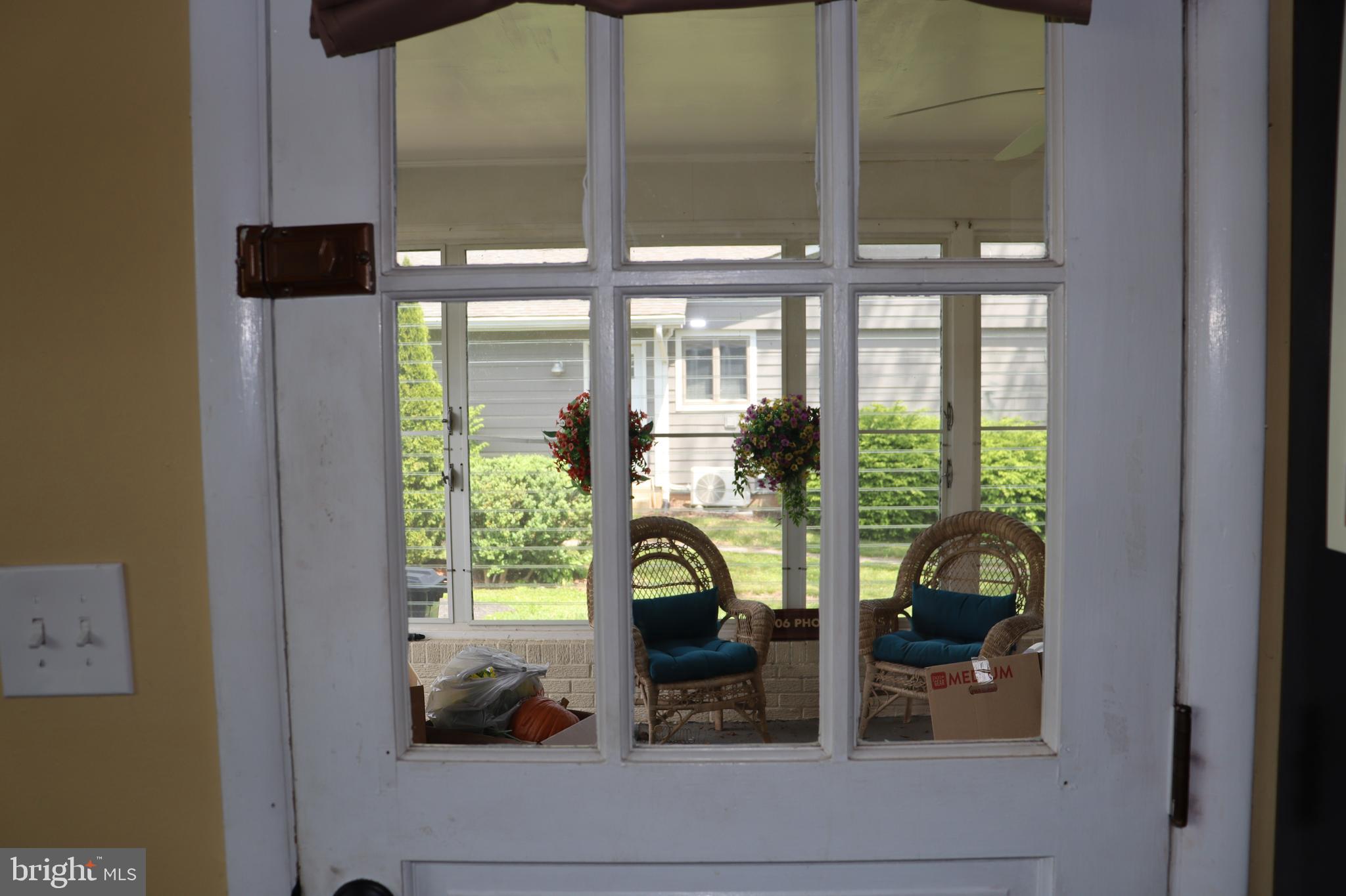 229 Dover Road Warrenton, VA 20186 - Photo 13 of 32 a view of living room with a large windows and flower plants