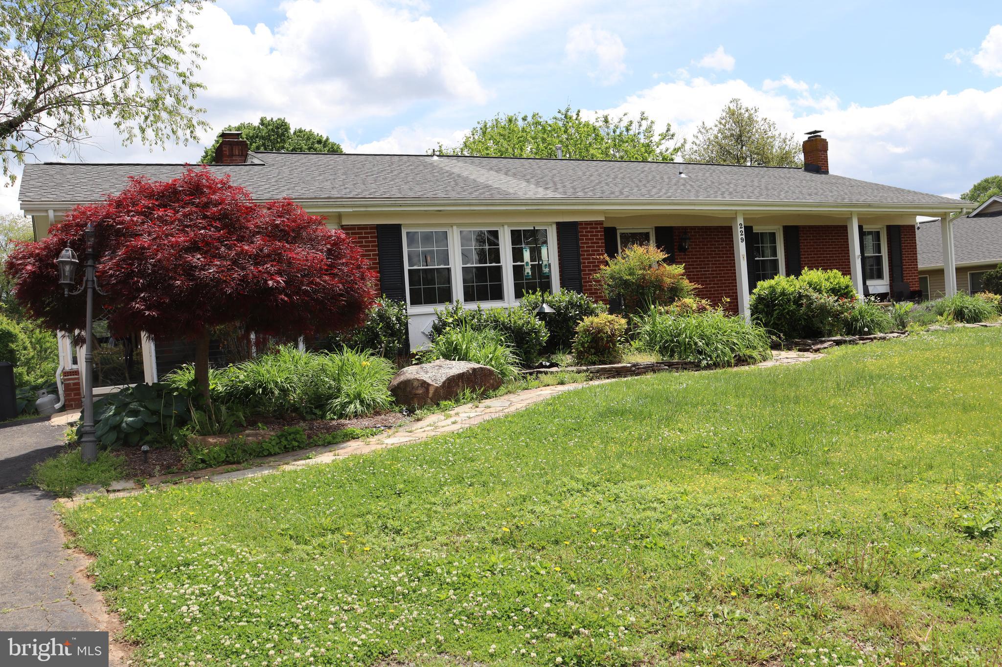 229 Dover Road Warrenton, VA 20186 - Photo 20 of 32 a view of a house with garden and yard