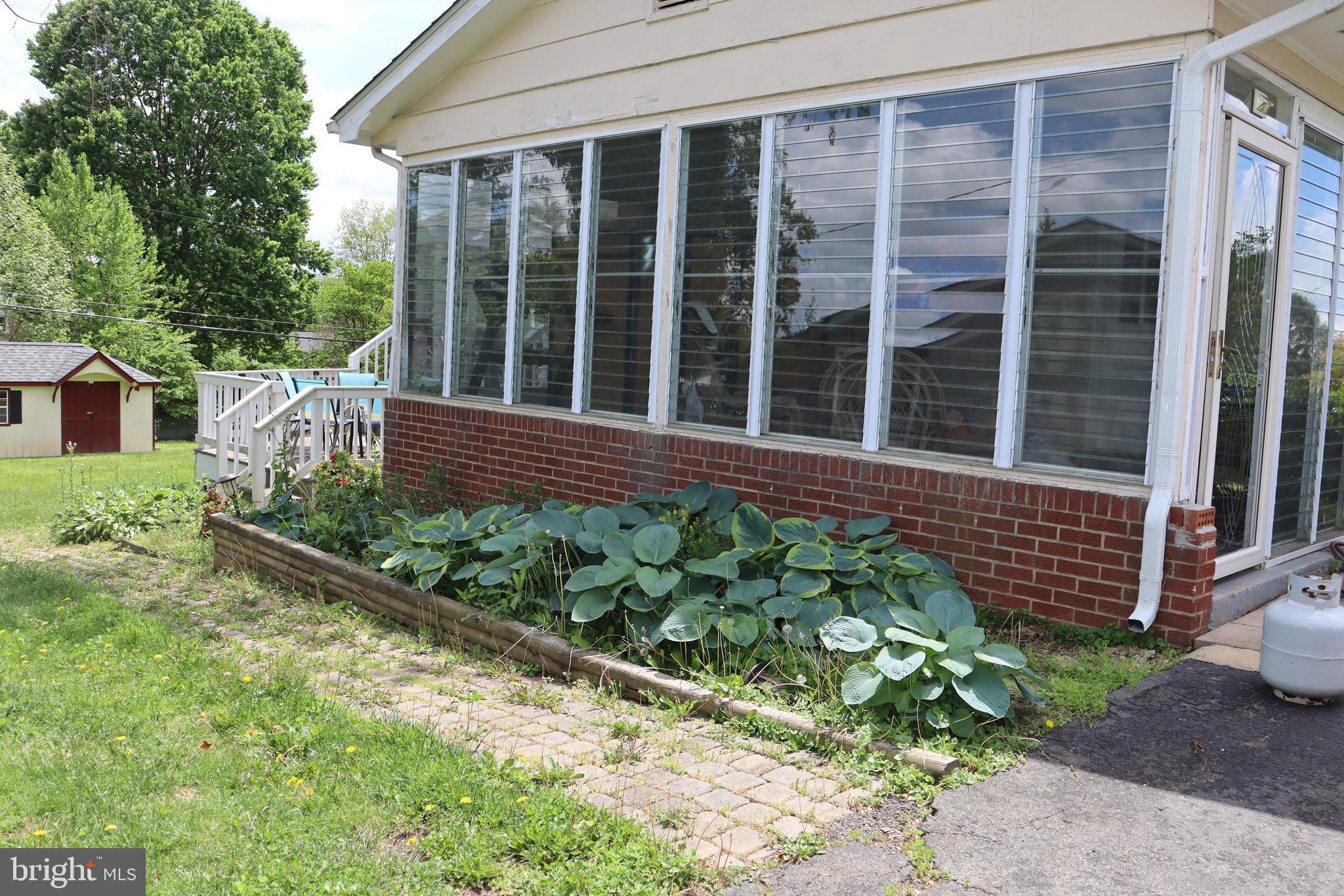 229 Dover Road Warrenton, VA 20186 - Photo 25 of 32 a wooden bench sitting in front of a house