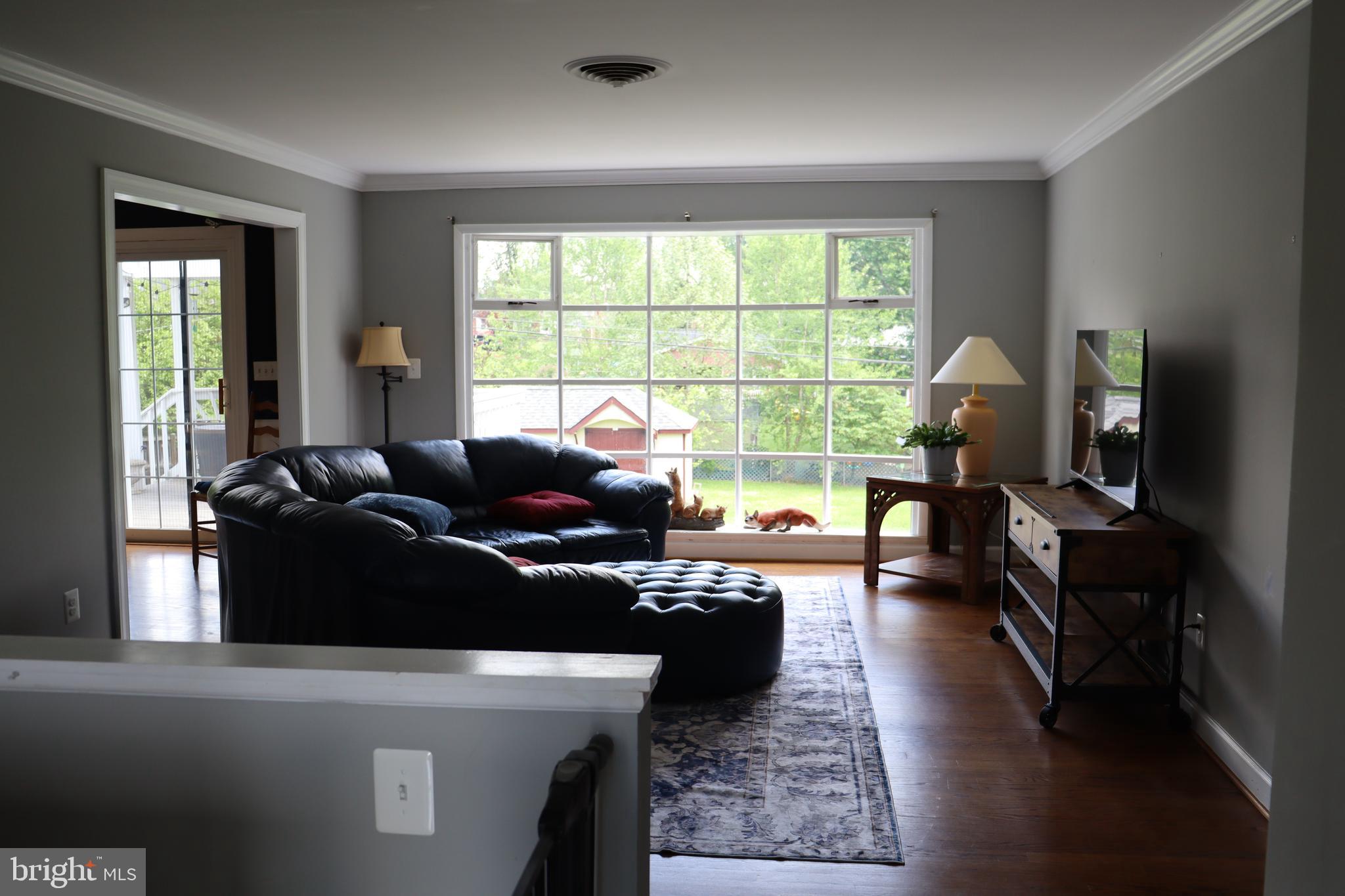 229 Dover Road Warrenton, VA 20186 - Photo 5 of 32 a living room with furniture and a large window