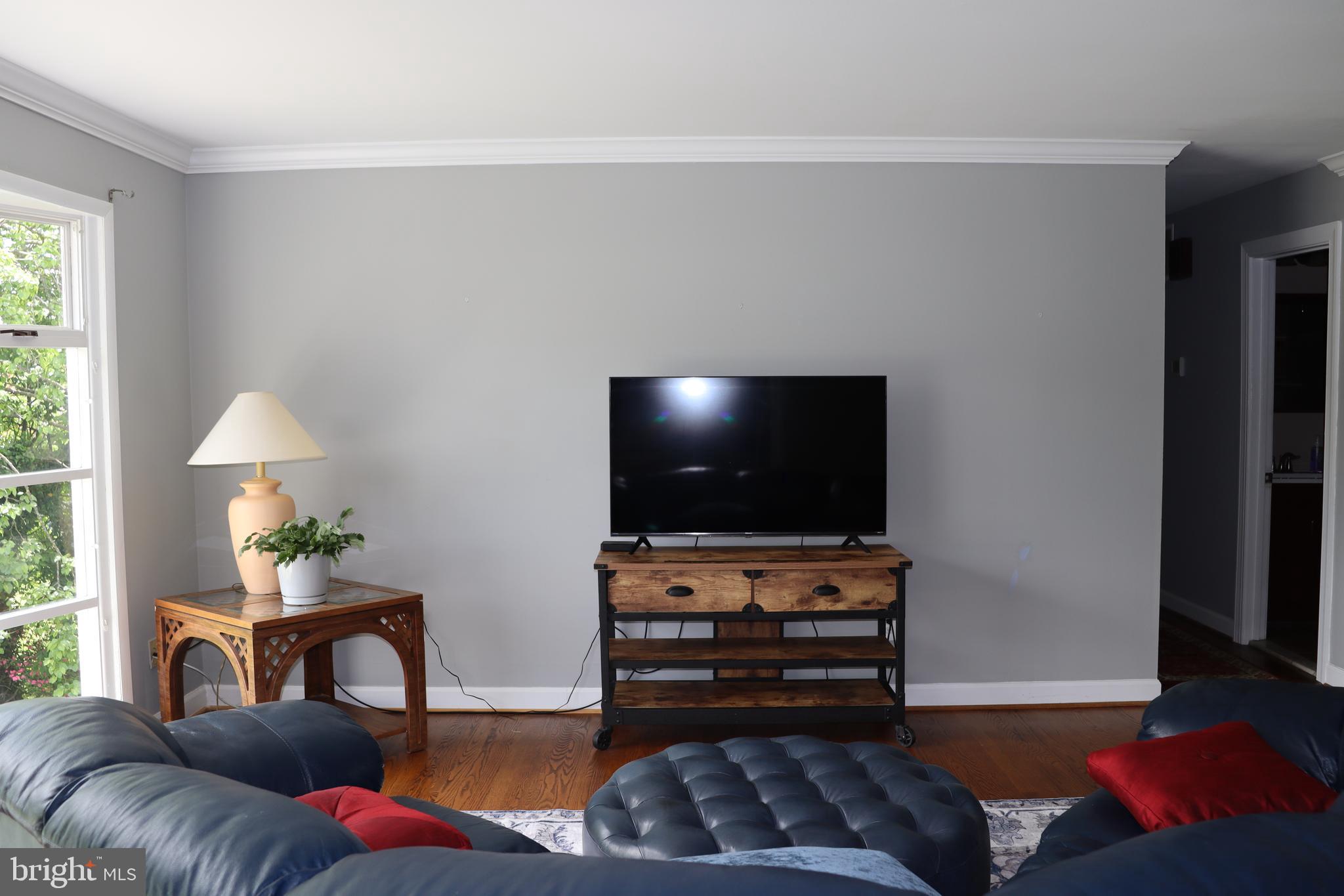 229 Dover Road Warrenton, VA 20186 - Photo 6 of 32 a living room with furniture and a flat screen tv