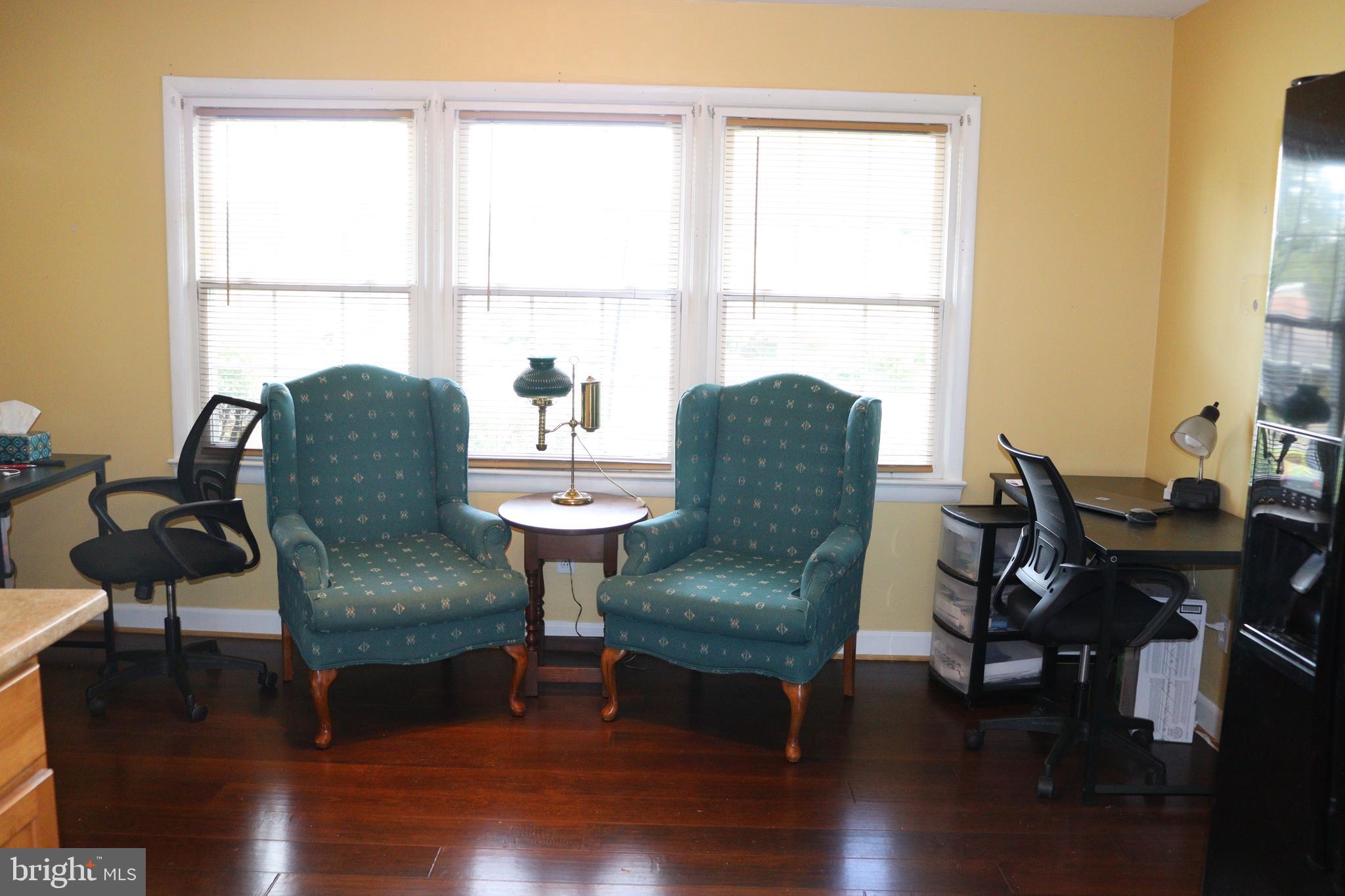 229 Dover Road Warrenton, VA 20186 - Photo 7 of 32 a living room with furniture a table and a window