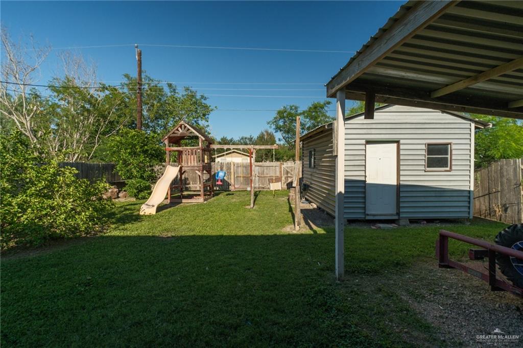 22899 Angel Street Primera, TX 78552 - Photo 16 of 19 a view of a chair and table in backyard of the house