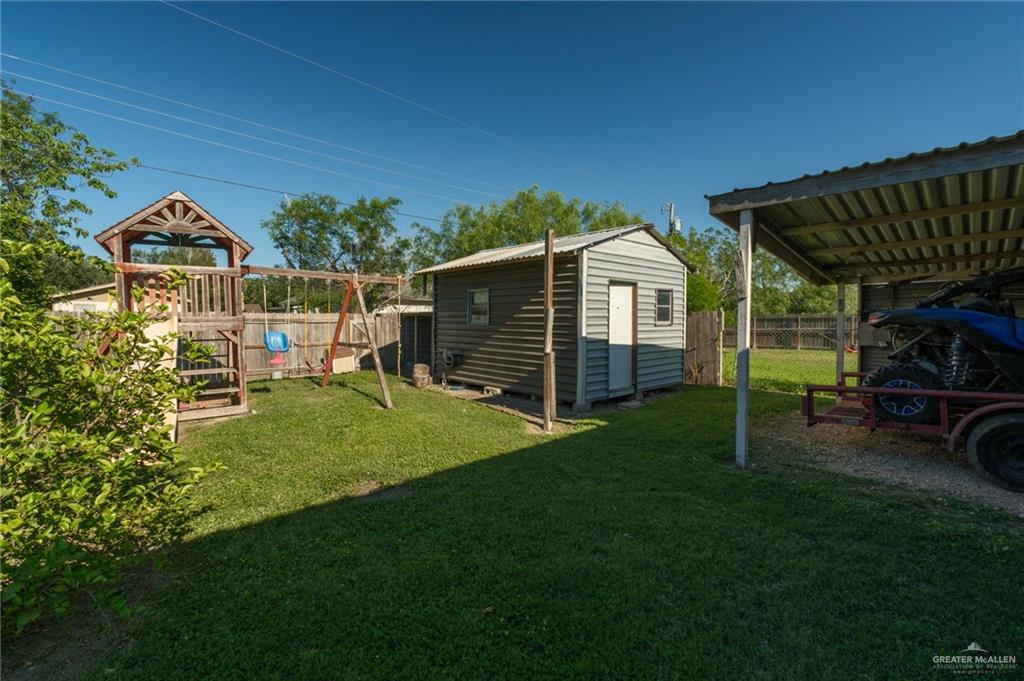 22899 Angel Street Primera, TX 78552 - Photo 17 of 19 a view of a house with a yard porch and sitting area