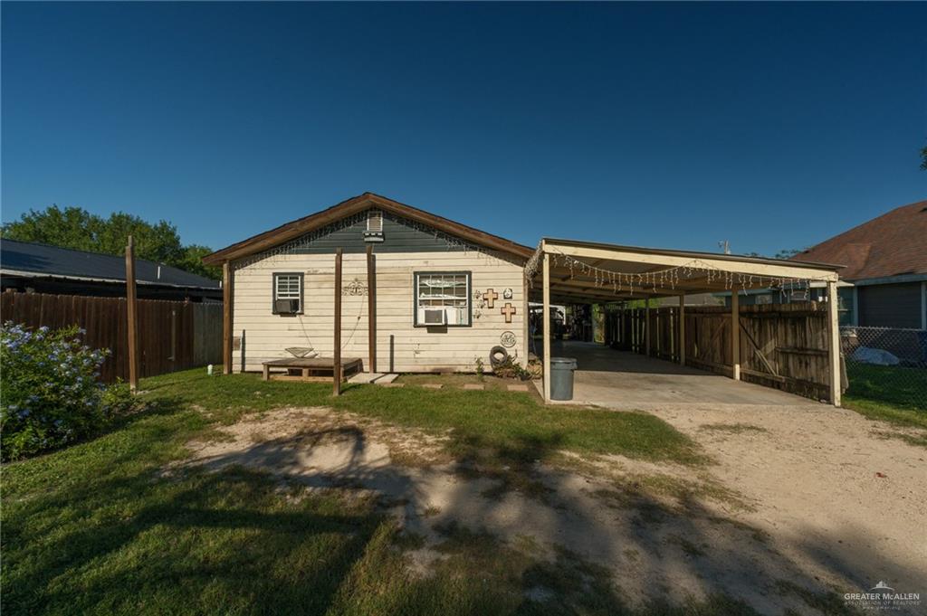 22899 Angel Street Primera, TX 78552 - Photo 18 of 19 a front view of a house with a yard