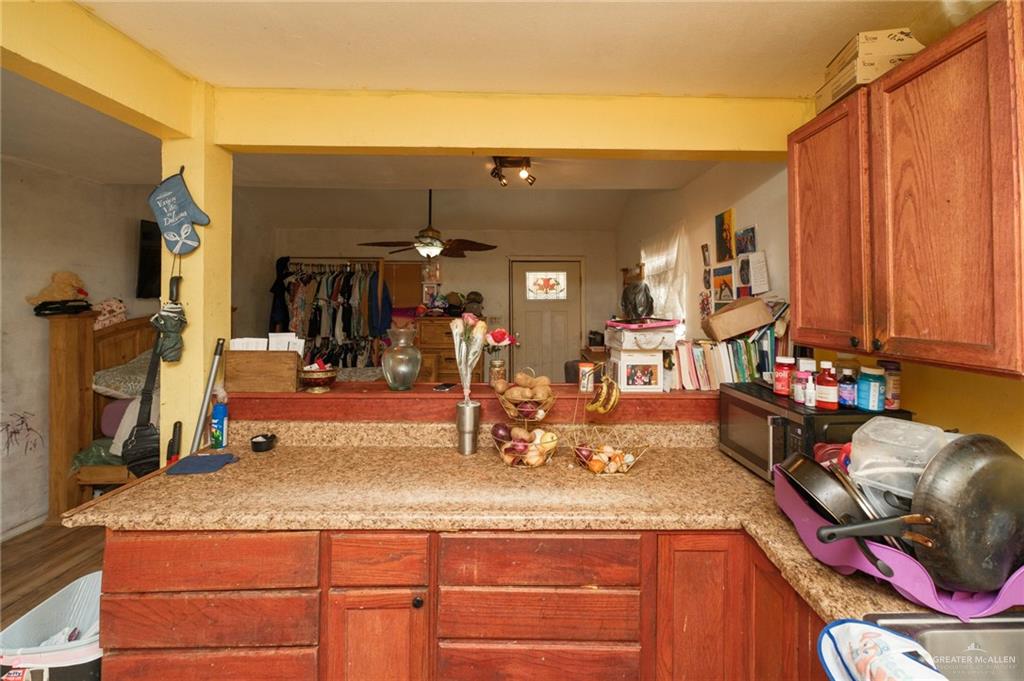 22899 Angel Street Primera, TX 78552 - Photo 4 of 19 a kitchen with stainless steel appliances granite countertop a sink and cabinets