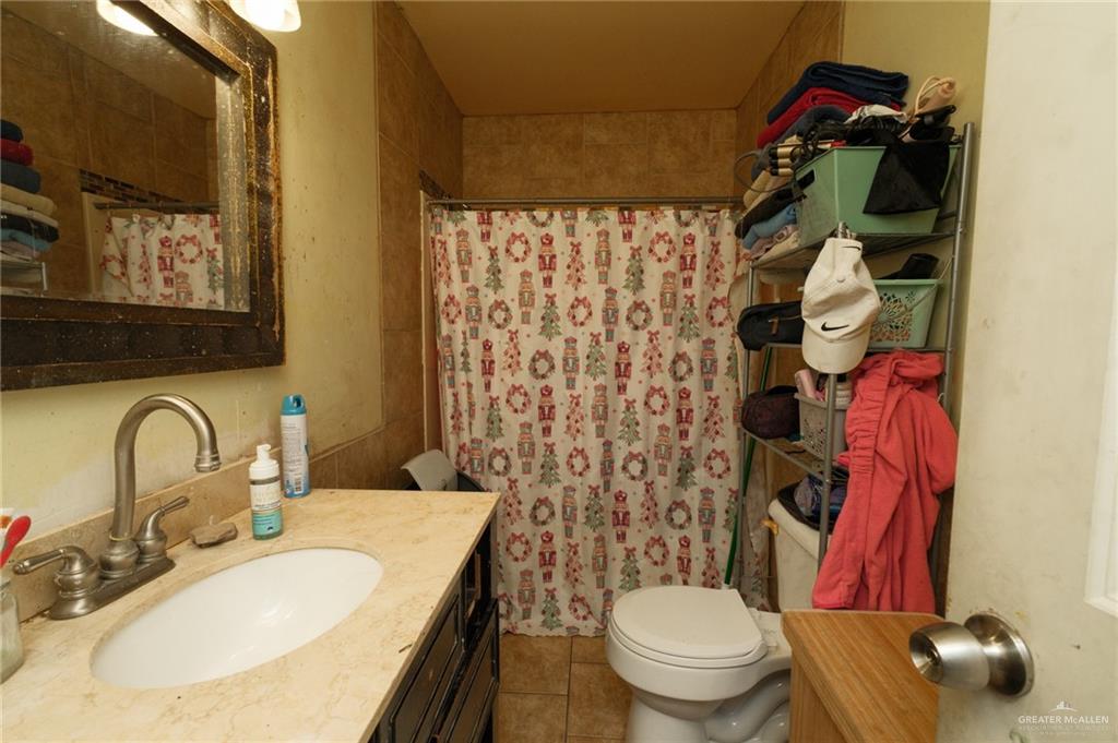 22899 Angel Street Primera, TX 78552 - Photo 10 of 19 a bathroom with a sink toilet and shower