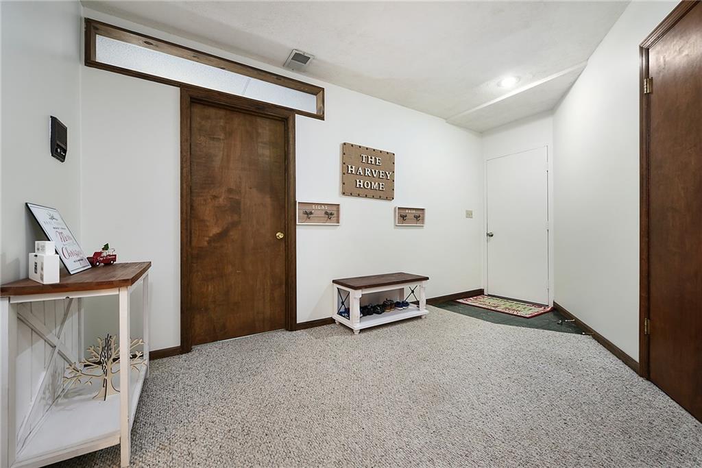 549 Center Church Road Canonsburg, PA 15317 - Photo 22 of 25 Entry area in Basement. Left door: Laundry Room, Middle (white) door: Garage, Right door: Unfinished Storage Space
