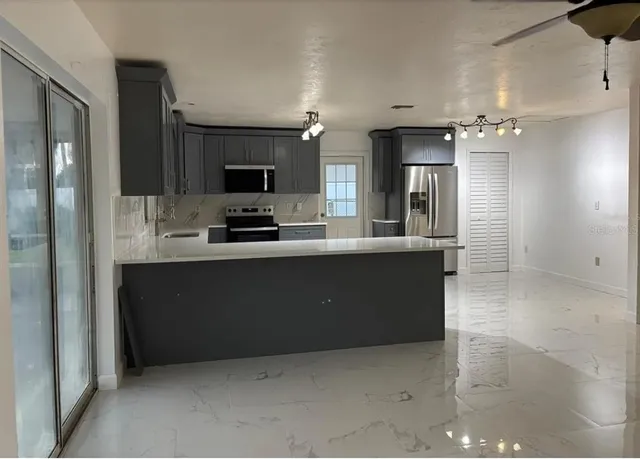 a large kitchen with a sink