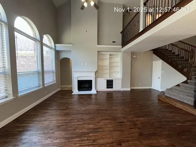 a view of empty room with fireplace