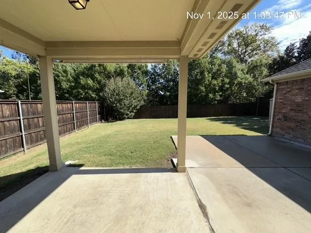 a view of backyard with green space
