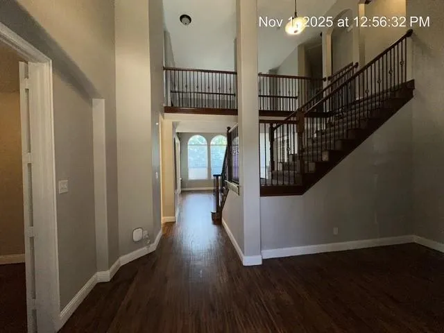 a view of entryway with wooden floor