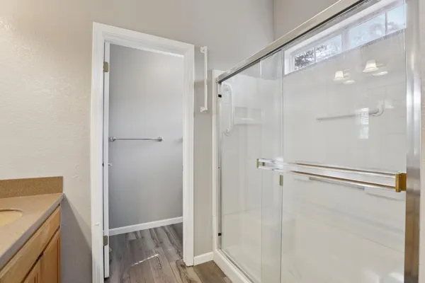 a view of walk in closet with empty racks