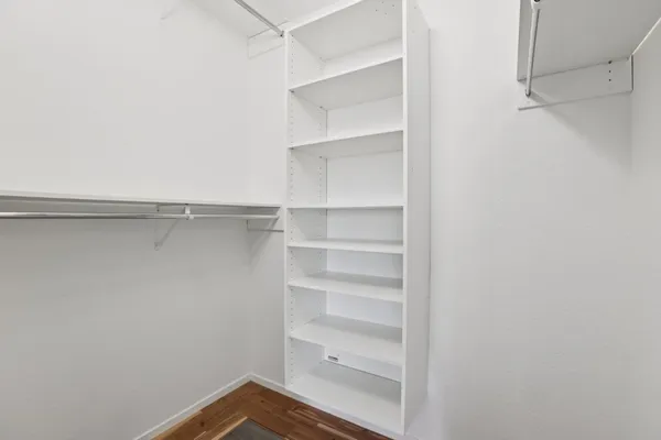 a view of an empty walk in closet