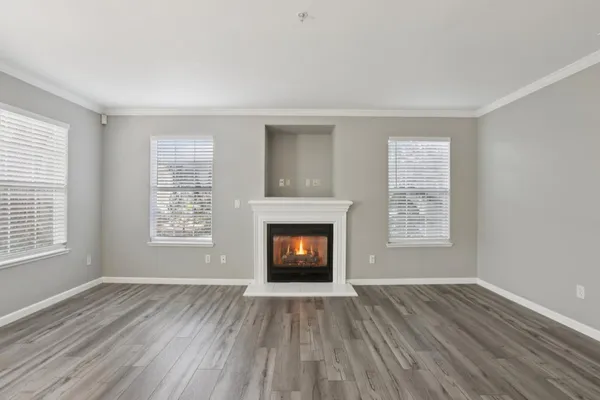 a view of a livingroom with a ceiling fan and window